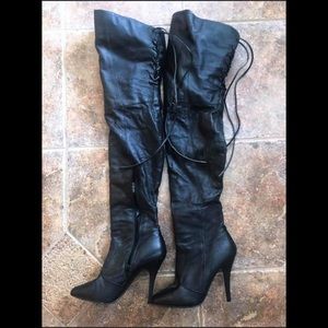 Thigh high black leather boots